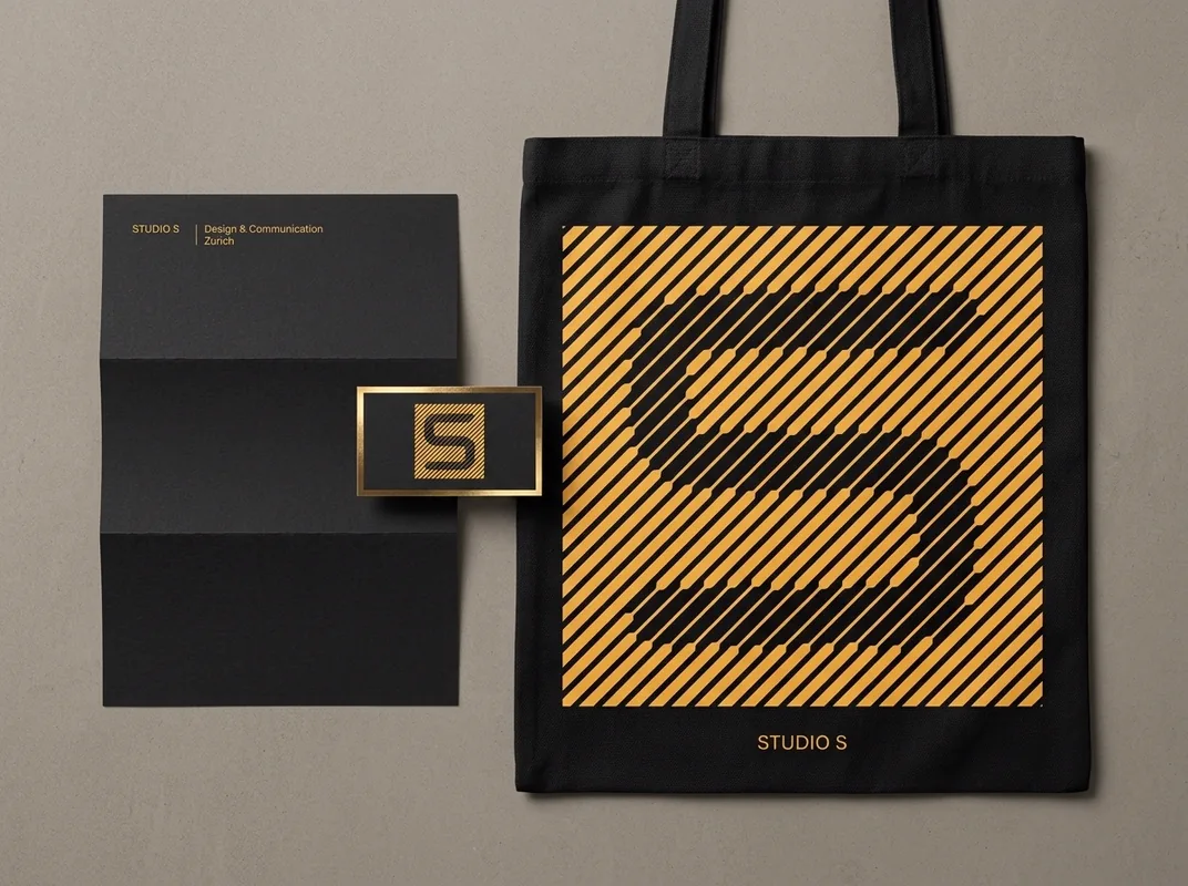 Brand stationery using a striped cut-out letterform