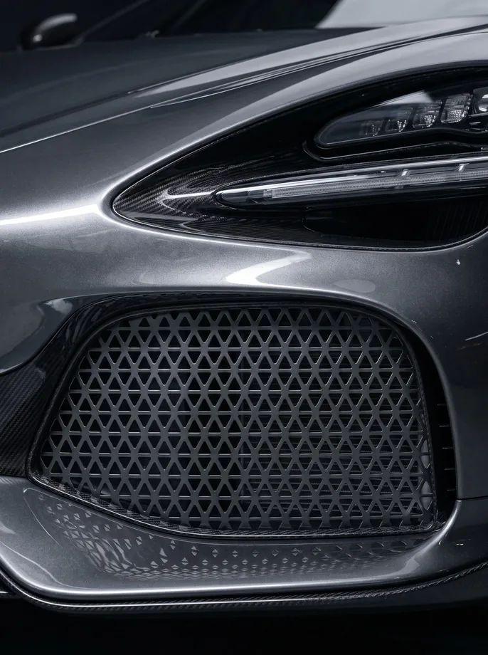 Supercar front intake screen perforated with a triangular mesh